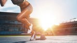 A professional runner is captured mid-stride, powerfully starting her run on a track. Her athletic form and dynamic movement symbolize strength and determination, representing athletes who rely on pessaries for pelvic support.