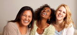 Image of three laughing 35+ women