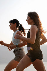 Two women running in athletic gear