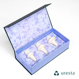 An opened box of the Uresta Starter Kit, showing three sizes of the device: size 3, size 4, and size 5, neatly arranged inside the box.